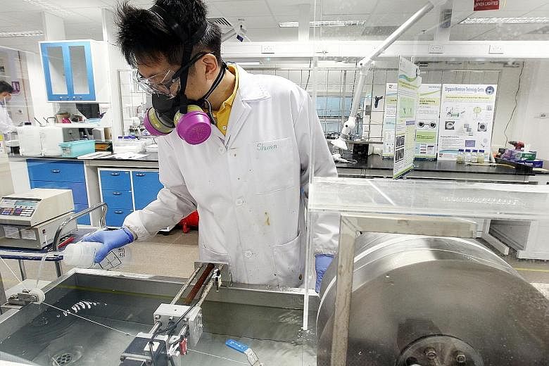 A researcher working at the Nanyang Environment and Water Research Institute.