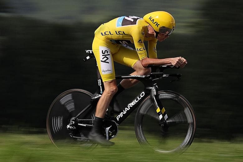 Chris Froome, wearing the overall leader's yellow jersey, riding to victory in the 18th stage of Tour de France between Sallanches and Megeve in the French Alps. He extended his lead over Bauke Mollema in the overall standings to 3min 52sec.