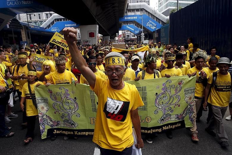 A Bersih supporter in AN August rally last year, when some 100,00 called for Mr Najib's resignation.