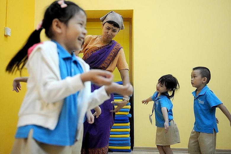 Ms Fiona Jeremiah from ACT 3 International facilitating a workshop that taught preschool children aged four to six about traditional Malay and Indian arts during a five-day pilot programme that ended yesterday.