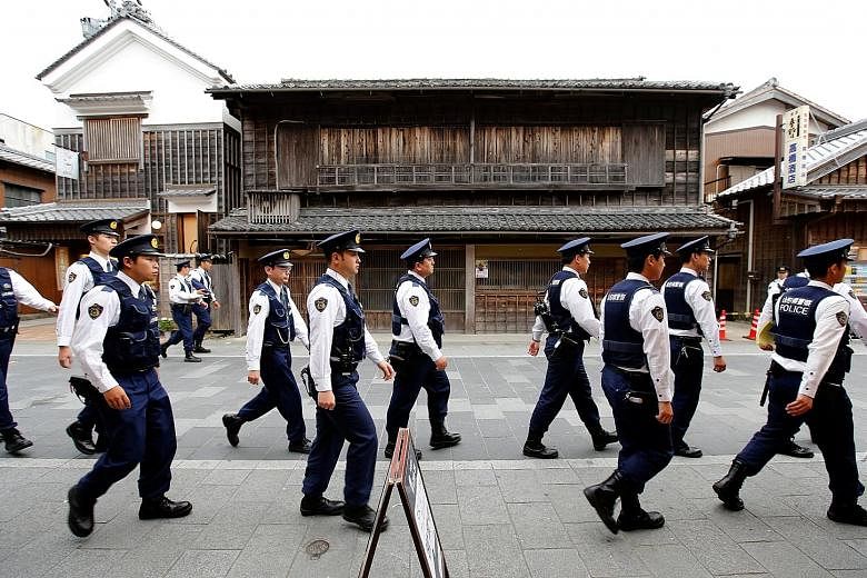 Policemen ahead of the G-7 summit in Japan in May. Experts say there is general apathy at home about the terror threat.