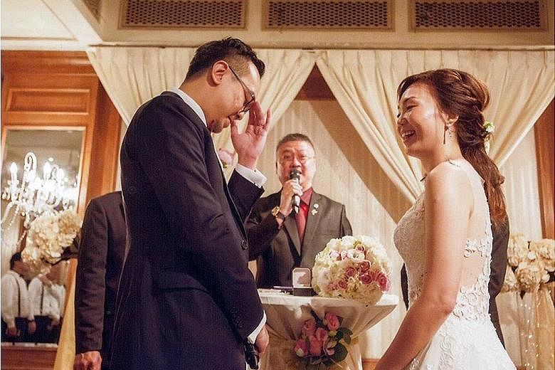Mr Lim (centre) solemnising the marriage of Mr Jeremy Si, 32, and Ms Hazel Ng, 31, this year. The 49-year-old is one of nearly 200 grassroots leaders who, since 1992, have been authorised to solemnise marriages.