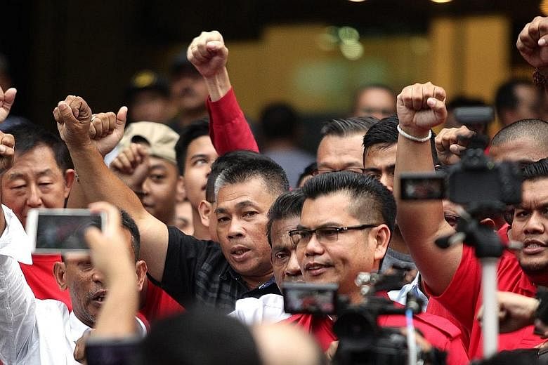 Mr Jamal (wearing glasses) talking to the press in Kuala Lumpur yesterday. He said the next Red Shirt rally, if it were to happen, would draw a much larger crowd than that of pro-reform group Bersih.