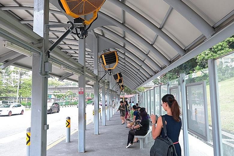 Oscillating fans at the bus stop along Ang Mo Kio Avenue 3, near Ang Mo Kio MRT station. The LTA is studying the feasibility of installing these, as well as linear-type fans for low-roofed sites, at other bus stops.