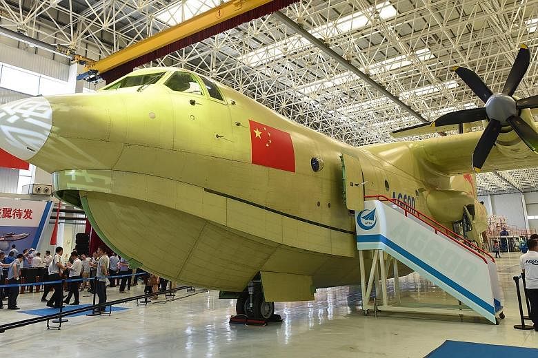 State-owned Aviation Industry Corporation of China unveiling the first of the new planes in Zhuhai on Saturday. The plane is about the size of a Boeing 737.