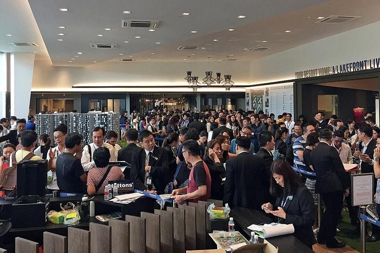 The packed showflat for the 710-unit Lake Grande condo in Jurong West Street over the weekend. About 87 per cent of the 500 units released for sale on Saturday were sold at an average price of $1,368 per sq ft.
