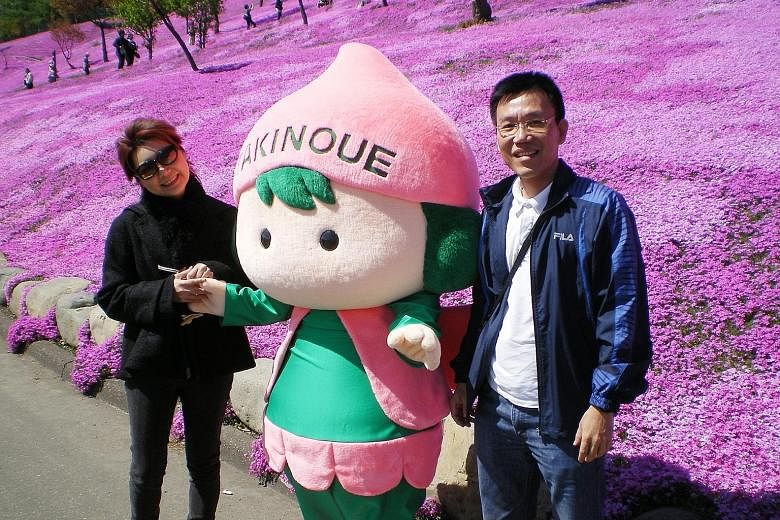 Mr Kho with his late wife, Ms Phelane Long, in a May 2010 photo taken in Hokkaido. A month before she died, Mr Kho quit his bank job to care for her round the clock. From left: Ms Tan, Prof Mahendran and Dr Lim. The latter two co-led the study of 258