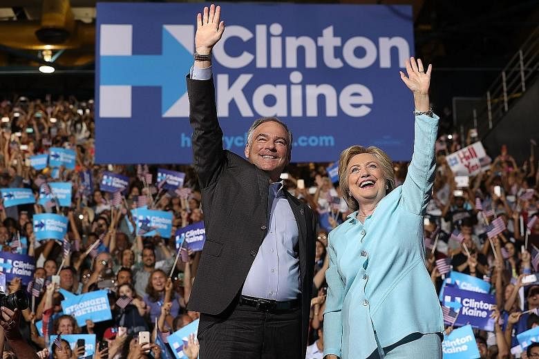 Mrs Clinton and Mr Kaine at a campaign rally in Miami, Florida, on Saturday, where the latter made his debut appearance as the Democratic presidential candidate's running mate.