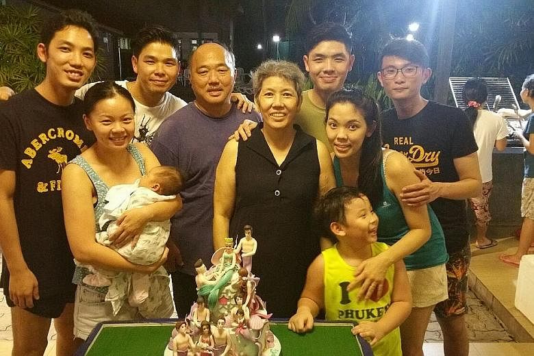 Madam Seow (centre) with family members at the gathering, including (from left) second son Calvin; his wife, Ms Peng Xueyun (with their baby Amelia); eldest son Lionel; Madam Seow's husband, Mr William Peh; youngest son Alvin; and daughter Patricia, 