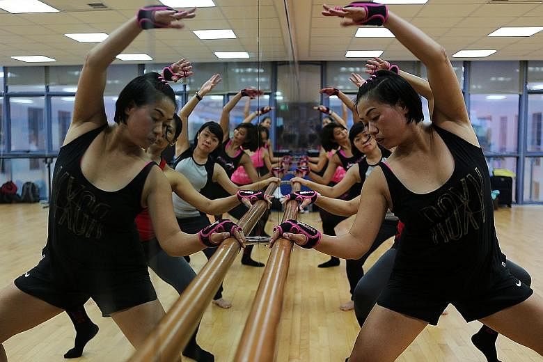 In Piloxing Barre, participants engage more of their muscles by using the barre to bend lower or raise their legs higher.