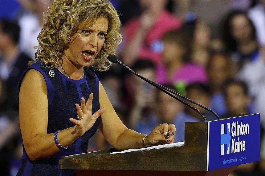 Evidence of the Democratic Party apparatus' attempt to damage Mrs Hillary Clinton's rival Bernie Sanders was embarrassing enough to force DNC chair Debbie Wasserman Schultz (above) to resign. An anti-Trump protester at the Republican National Convent
