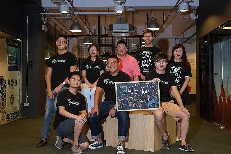 Mr Liang (front row, centre) with his AfterYou FindHelper team. He is flanked by chief operating officer Jason Teo (on his left) and Teo YiRong. Standing behind them are (from left) Mr Ashley Moey, Ms Belinda Phua, Mr Kelvin Lim, Mr Henrik Lange Hovi