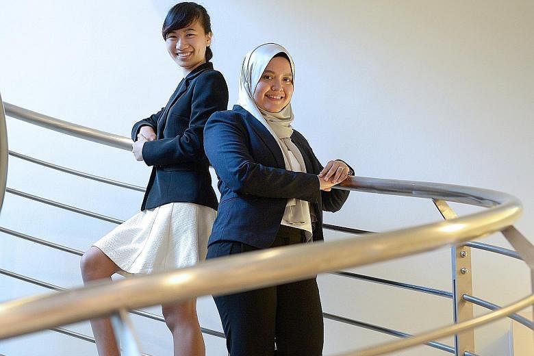 Ms Tan Guan Rong, 22 (at left), and Ms Hanisah Abdullah Sani, 32, were among 20 aspiring academics who yesterday received scholarships that will help them pursue a career in teaching and research. The Singapore Teaching and Academic Research Talent S