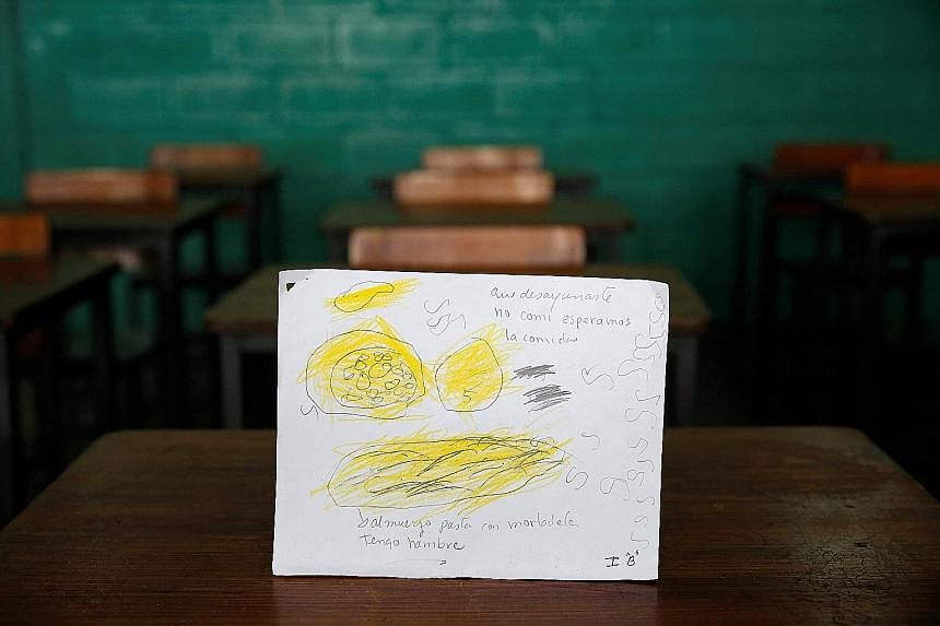 Padre Jose Maria Velaz school pupils in Venezuela draw their most recent meals. (Top) 'Today and yesterday, I ate bread for breakfast; yesterday, I had sardine with yucca, butter and water for lunch and had nothing for dinner.' (Centre) 'Ate a corn c