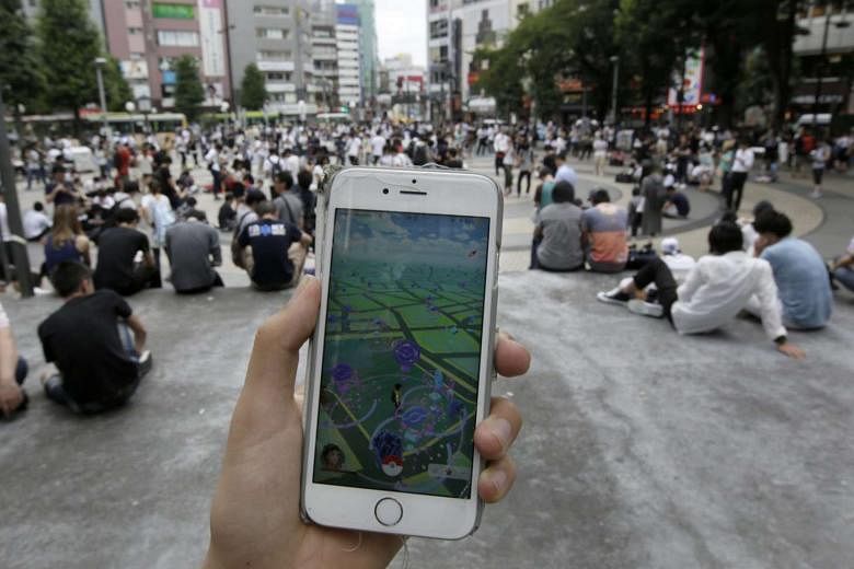 Pokemon Go may be the hottest game in town, including in Japan (above), but it made its debut after the latest quarter ended and will not have a measurable impact on Nintendo's results. 