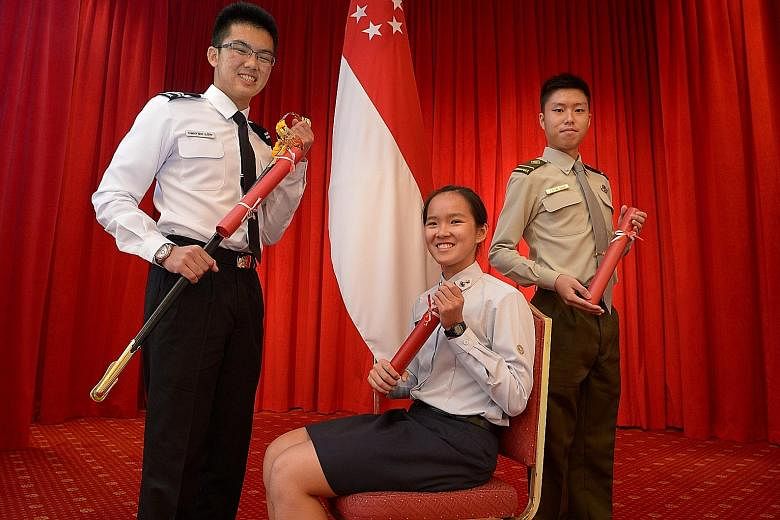 Ms Ho (centre) is one of the 47 recipients of the SAF and Mindef scholarships this year. With her are Mr Danyon Low Ming Loon (left), 19, a recipient of the SAF Scholarshipand Mr Justin Goh Shu Hao, 20, who was also awarded the new SAF Engineerin