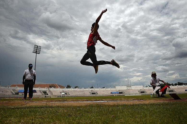 Singaporean Joseph Zhao in action during the Asean Schools Games long jump final. He won gold with a 6.70m effort.