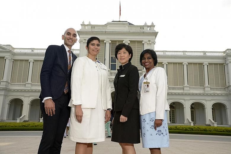 The four who won the highest accolade in the nursing profession are (from left) Mr Raveen Dev Ram Dev, Ms Hanijah Abdul Hamid, Ms Chen Yee Chui and Ms Lathy Prabhakaran, who received their award from President Tony Tan at the Istana yesterday.