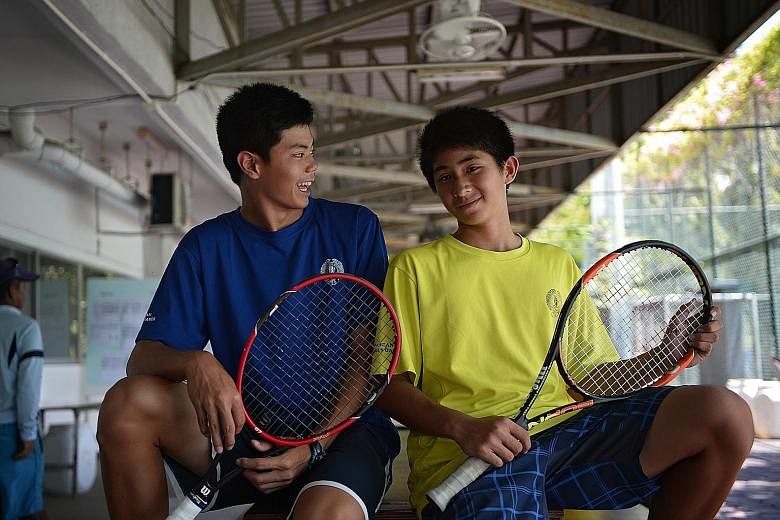 Brothers and tennis players Jeremy (left), 16, and Jerall Yasin, 13, prefer to play singles rather than doubles. But they still spur each other on.