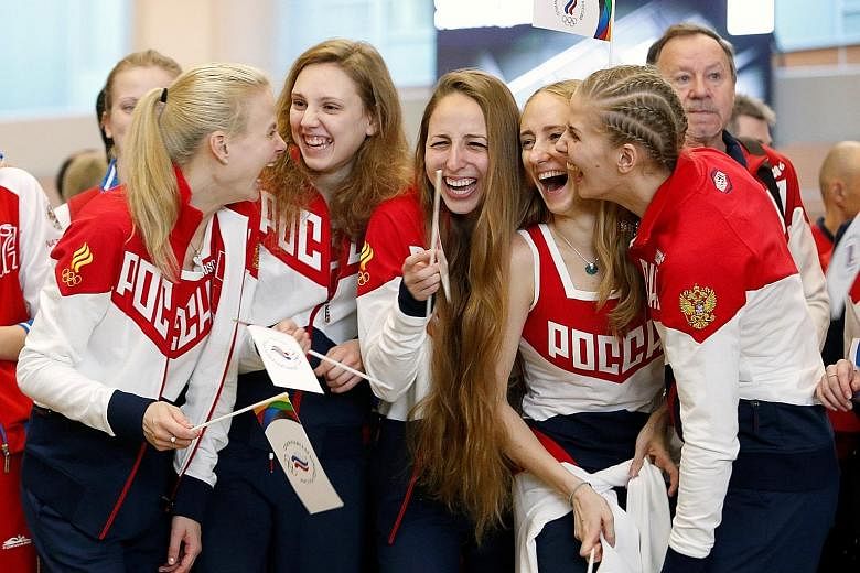 Russia's synchronised swimming Olympic team members in high spirits during a farewell ceremony before departing for the Rio Olympics at Sheremetyevo International Airport.