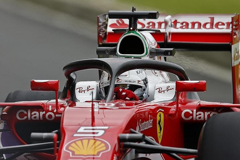 Sebastian Vettel practising with a Ferrari fitted with the halo before this month's British Grand Prix. The head protection device remains a subject of debate among the F1 drivers.