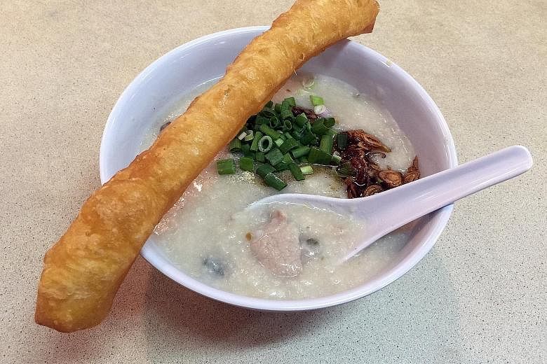 A stick of youtiao (left) completes the simple meal of congee.