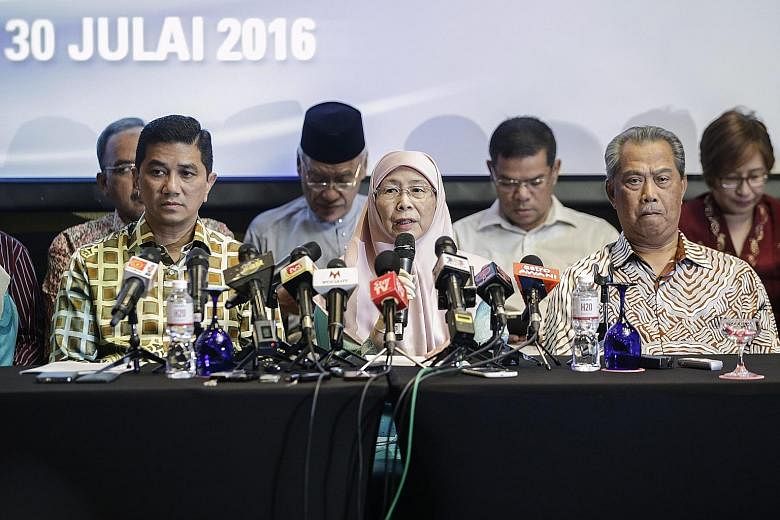 Former DPM Mr Muhyiddin (at right) with PKR president Dr Wan Azizah (centre) and other party leaders at a media conference yesterday. Mr Muhyiddin said the PKR would hold meetings in rural areas, where the bulk of support for the ruling Umno coalitio