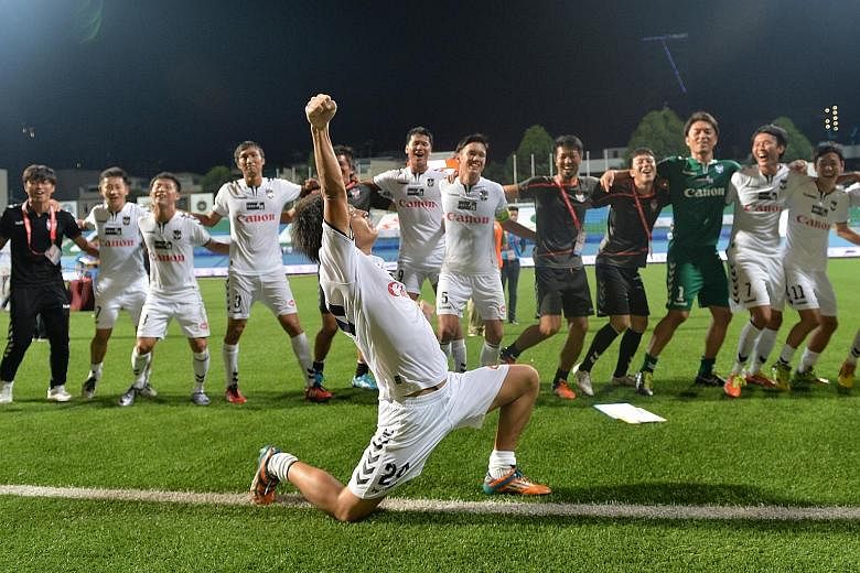 Albirex players celebrating after their 2-0 victory against Brunei DPMM yesterday to clinch The New Paper League Cup. The victory was the White Swans' second title of the season, after the Community Shield.
