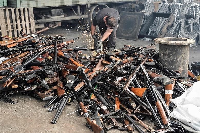 Illegal weapons seized by the authorities being cut up into pieces before being destroyed at a foundry. Firearms are easy to obtain in Kosovo, where violence and extremism have been on the rise, often fuelled by Arab-linked networks and organisations