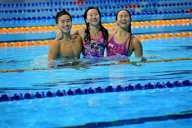 Quah Zheng Wen (left) made his Olympic debut at the 2012 London Games. In Rio, he will be joined by elder sister Ting Wen (right) while younger sister Jing Wen hopes to be an Olympian at Tokyo 2020.