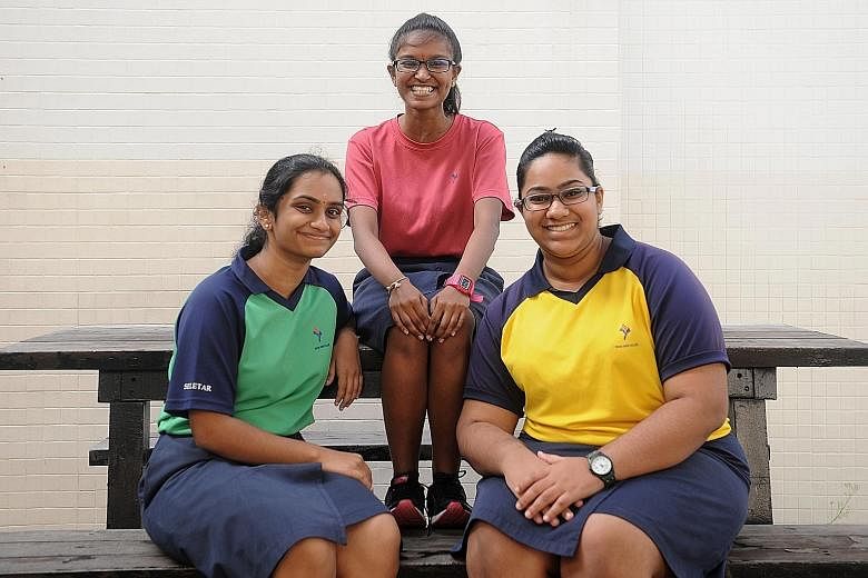 JC2 students (from left) C.H. Sanjana, Sangeetha Muthukumar and Deenah Haja Maidin are reading both local and Indian texts as part of their Tamil Language and Literature classes at Yishun Junior College.
