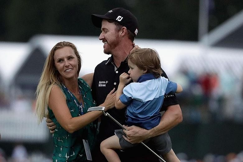 Walker celebrating with his wife Erin and son Beckett after winning the 2016 US PGA Championship on Sunday.
