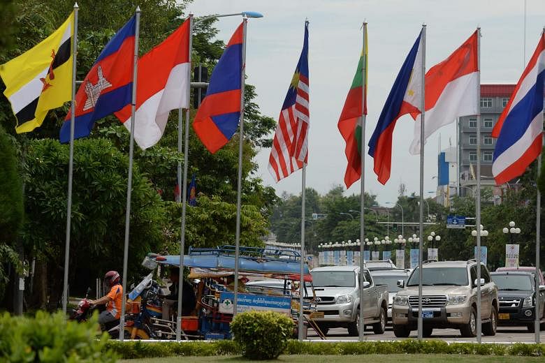 Asean countries' flags flying in Vientiane, Laos, as the country prepares for an economic ministers' meet. Economic cooperation among the 10 nations has the potential to deliver a more integrated and united Asean. 
