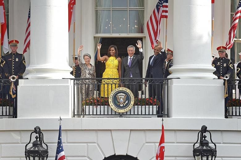 PM Lee and Mr Obama greeting the crowd together with their wives at the White House yesterday. In his remarks, PM Lee noted that Singapore's ties with the US have withstood many political changes and remained steadfast, adding that "we will maintain 