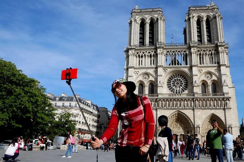 Paris/France - September 10, 2019 : Asian tourist girl with a