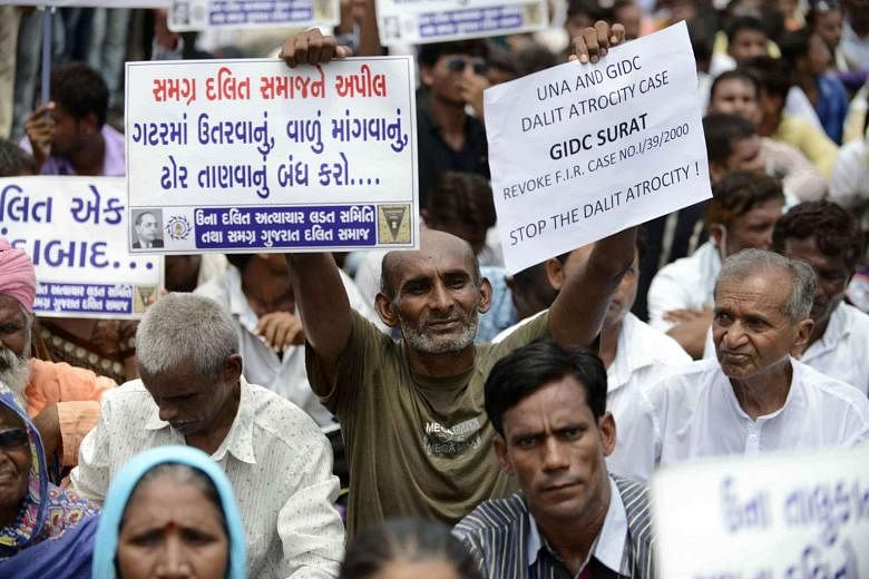 Ms Patel resigned on Monday following protests by the Dalit community (above), triggering a search for a successor. 