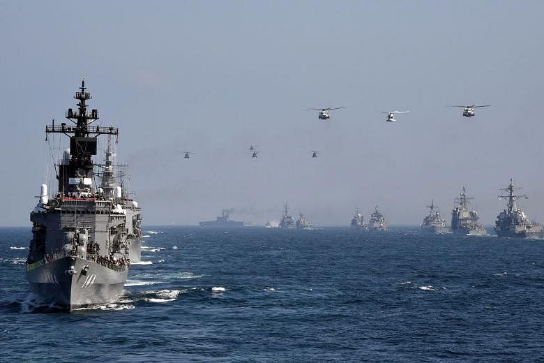 Japanese navy ship Kurama taking part in a fleet review off Japan's Sagami Bay last year, together with the navies of Australia, India, France, South Korea and the United States. Tensions between Tokyo and Beijing over islets in the East China Sea - known