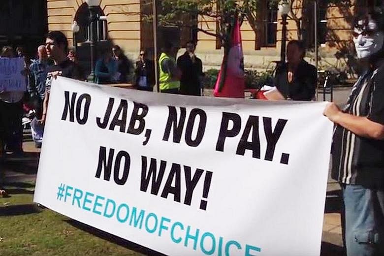 A protest in Australia in June last year against the country's controversial "no jab, no pay" policy to compel parents to get their children vaccinated. "Anti-vaxxers" say standard vaccines can cause autism and pose unneccesary risks to children - cl