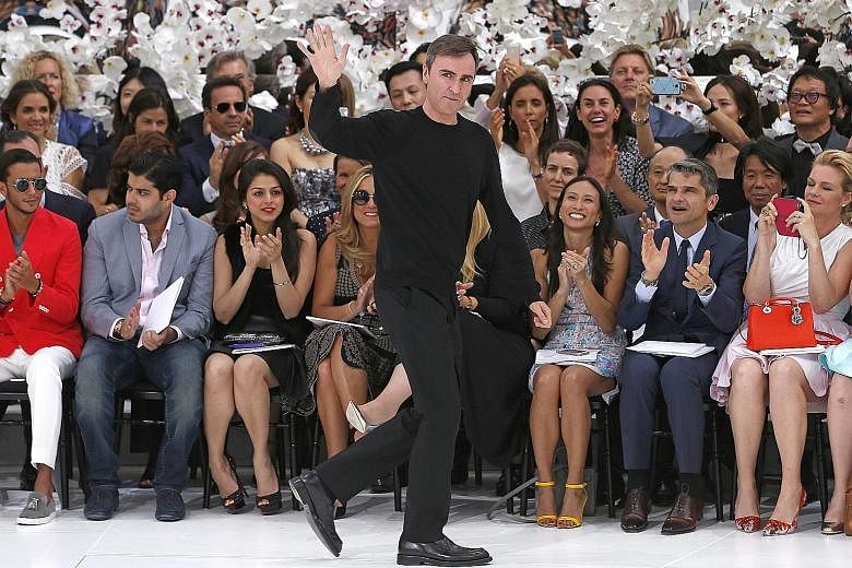 Belgian designer Raf Simons (left) at his Haute Couture Autumn-Winter runway show for Christian Dior in Paris in July.
