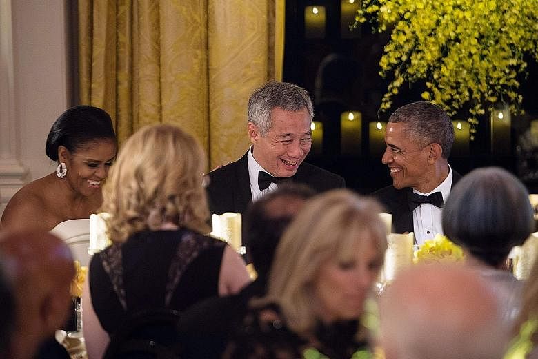 PM Lee with Mr and Mrs Obama at the White House state dinner, the first held in Singapore's honour in three decades. Mr Obama called for both nations to "continue to build something special together", while PM Lee hailed the President's leadership, s