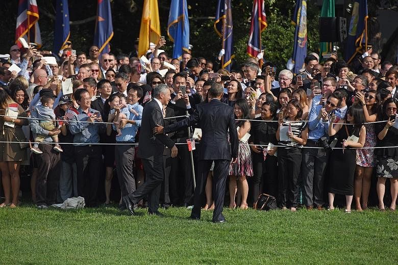 US President Obama and PM Lee meeting spectators gathered at the White House on Tuesday. Singapore was given a state dinner, one of the US government's highest diplomatic honours.