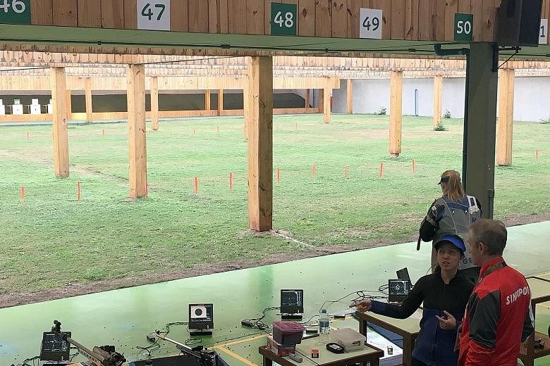 Jasmine Ser with her coach Kirill Ivanov during practice at the Olympic Shooting Centre in Rio de Janeiro on Wednesday. The second-time Olympian will skip the opening ceremony tonight so that she is ready to compete in he 10m air rifle event.