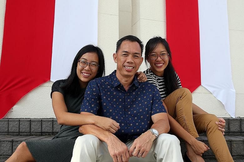 Among those given awards at the Home Team National Day Observance Ceremony yesterday were twins Adrienne (left) and Marienne, and their father Vincent Chew. They had saved their teenage neighbour from being strangled and robbed last November.