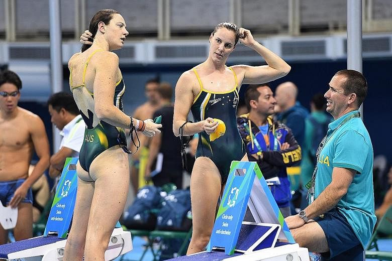 Cate Campbell (far left) and younger sister Bronte during the Australian team's first training session in Rio on Monday.