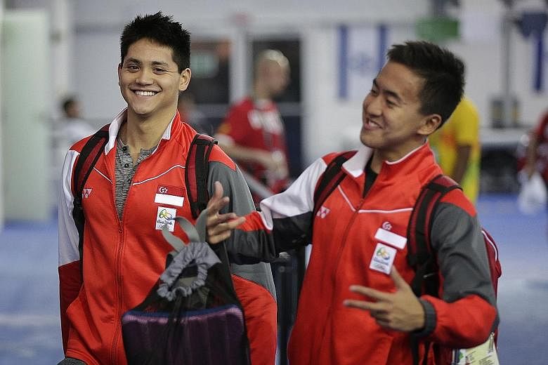 Singapore's Joseph Schooling and Quah Zheng Wen sharing a light moment after training. The duo are part of the smallest swimming contingent Singapore has sent to an Olympics, but according to coach Sergio Lopez, have the potential to be the most succ