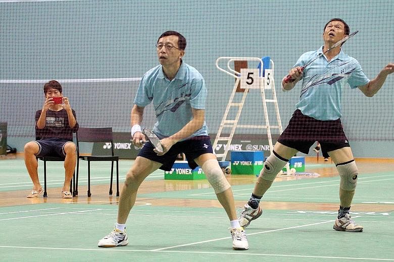 Brothers Yap Wee Teck (left) and Yap Wee Jin will defend their badminton men's doubles title at the Singapore National Games. Communication has been key to their success.