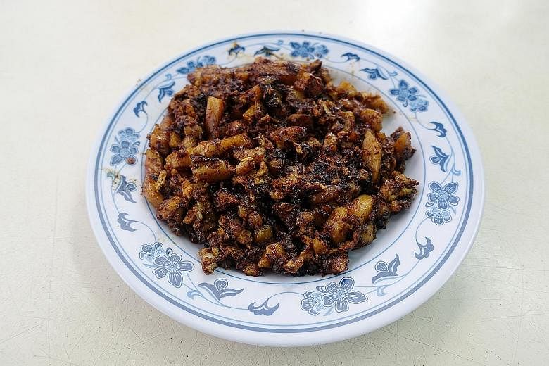 Potong Pasir King Specialist Carrot Cake's black chye tow kueh (above). It offers the white version too.
