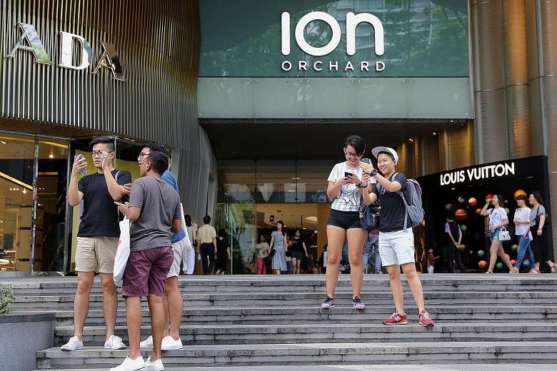 Pokemon Go fans looking for the iconic virtual monsters outside Ion Orchard, after the shopping mall started releasing lures. These are items that players can buy in-game which attract more Pokemon to the area. The mall is taking advantage of the gam