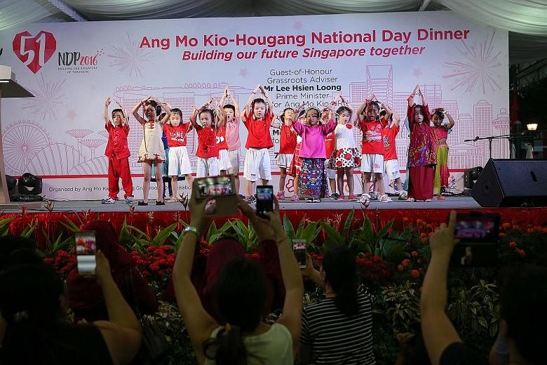 Children performing at yesterday's Ang Mo Kio-Hougang National Day Dinner, attended by PM Lee and his fellow MPs, as well as around 1,300 residents. His National Day Message, recorded at the newly opened Safra clubhouse in Punggol, will be broadcast 