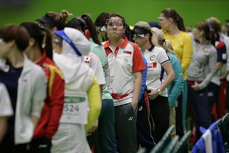 Singapore's Teo Shun Xie reacting to a bad shot during the 10m air pistol qualification round at the Olympic Shooting Centre. The Olympic first timer felt fine in the warm-up but admitted that nerves got the better of her in the end.